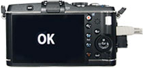 Do not disconnect the camera from the computer until the LCD on the camera displays OK.